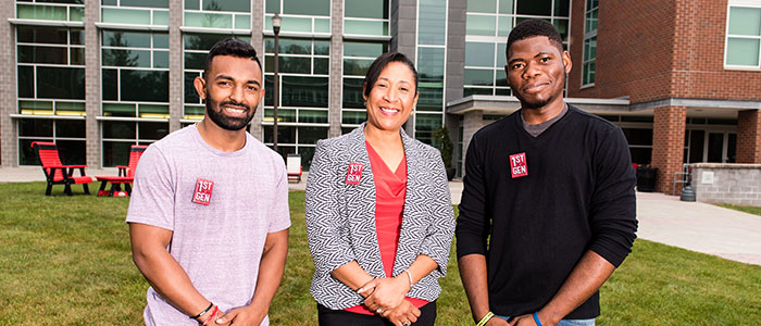 Faculty and staff who were in the first generation of their families to go to college wear buttons that say “1ST GEN” to identify themselves on campus for current first-generation students.