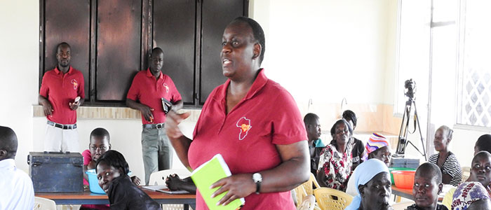 Beldina speaks to a group of people