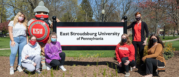 East Stroudsburg University students who took part in a U.S. Centers for Disease Control and Prevention study that looked at mask-wearing on 53 college campuses around the country pose with the Warrior mascot.