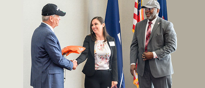 Dr. Mark Erickson, president, Northampton Community College, Elizabeth Reeves, and Kenneth Long, interim president, East Stroudsburg University exchange gifts after a signing agreement at Northampton Community College