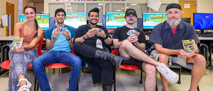 Students and professor display new card game
