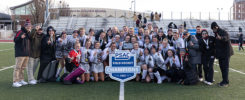ESU field hockey team poses with the PSAC championship trophy