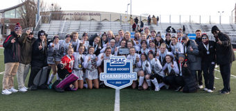 ESU field hockey team poses with the PSAC championship trophy